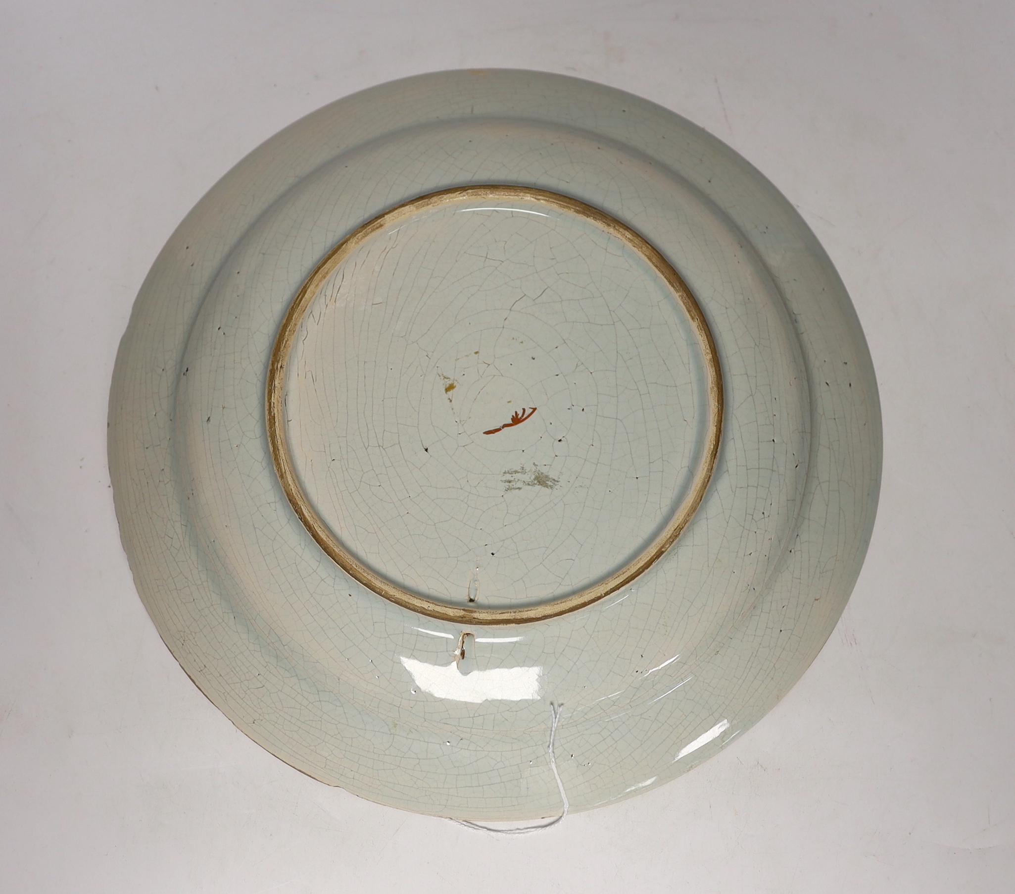 An 18th century Delft polychrome charger, 34cm